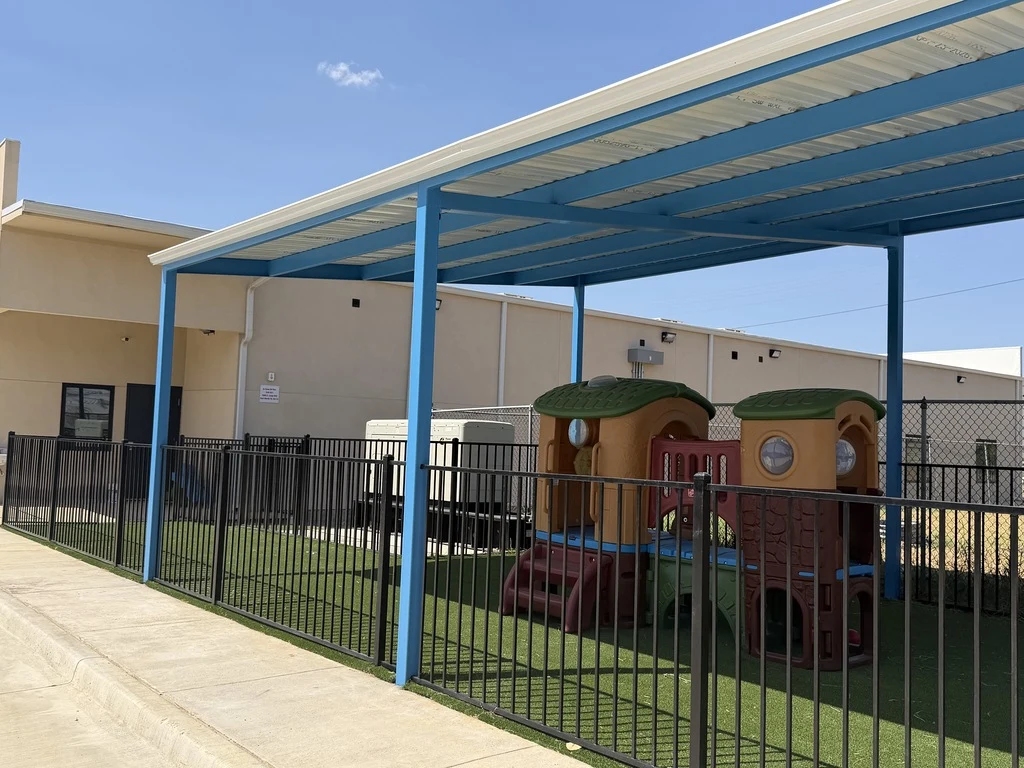 Covered playground at a completed pediatric care facility in Fort Worth, Texas